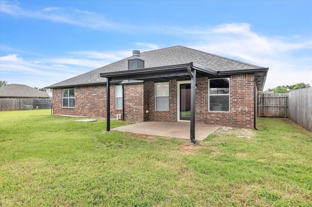 2309 NW 157th Ter, Edmond, OK 73013 - back of house with a patio, brick siding, and a shingled roof