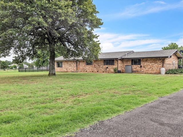 34207 Clearpond Rd, Shawnee, OK 74801 - ranch-style home featuring brick siding, central air condition unit, and a shingled roof