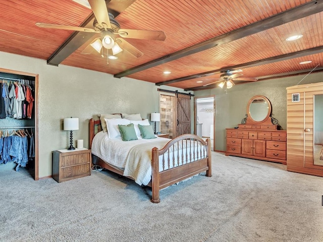 34207 Clearpond Rd, Shawnee, OK 74801 - bedroom with wood ceiling with exposed beams, carpet floors, a barn door, a textured wall, and a closet