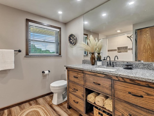 34207 Clearpond Rd, Shawnee, OK 74801 - bathroom with wood finished floors, vanity, toilet, a shower, and baseboards