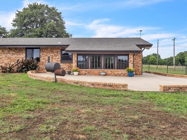 34207 Clearpond Rd, Shawnee, OK 74801 - back of house featuring a patio area, brick siding, and roof with shingles