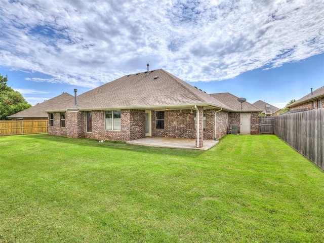 4305 NW 164th Ter, Edmond, OK 73013 - rear view of house with a patio area, a shingled roof, central AC unit, and brick siding
