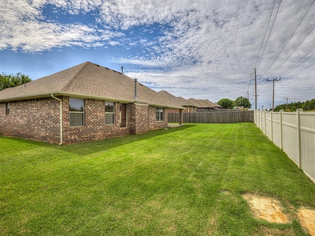 4305 NW 164th Ter, Edmond, OK 73013 - back of house featuring brick siding and a shingled roof