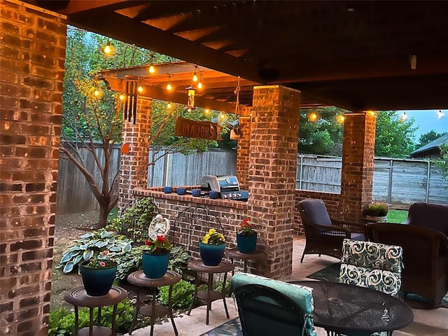 2717 Cordgrass Ln, Edmond, OK 73013 - fenced backyard featuring a patio, a grill, and outdoor dining space