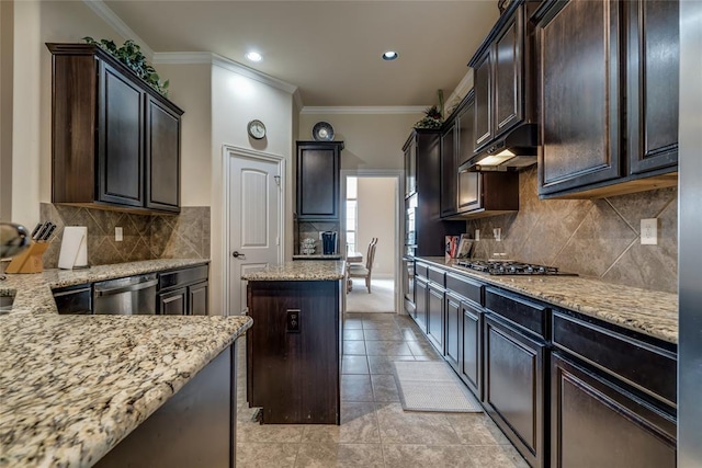 2717 Cordgrass Ln, Edmond, OK 73013 - kitchen featuring stainless steel appliances, ornamental molding, light stone countertops, light tile patterned floors, and dark brown cabinetry