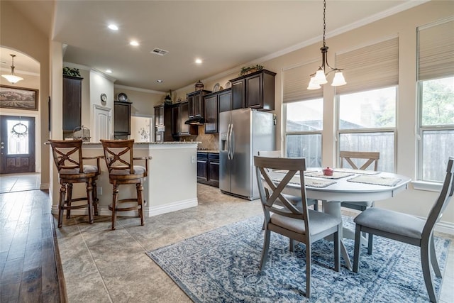 2717 Cordgrass Ln, Edmond, OK 73013 - dining space with ornamental molding and recessed lighting