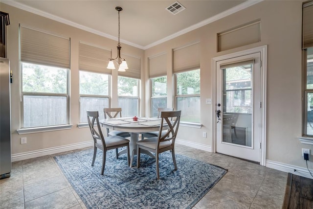2717 Cordgrass Ln, Edmond, OK 73013 - dining room featuring crown molding, a chandelier, baseboards, and tile patterned floors