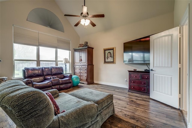 2717 Cordgrass Ln, Edmond, OK 73013 - living area with a ceiling fan, high vaulted ceiling, dark wood-style flooring, and baseboards