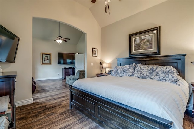 2717 Cordgrass Ln, Edmond, OK 73013 - bedroom with vaulted ceiling, dark wood-style floors, baseboards, a ceiling fan, and arched walkways