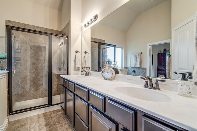 2717 Cordgrass Ln, Edmond, OK 73013 - full bath with double vanity, lofted ceiling, and a shower stall