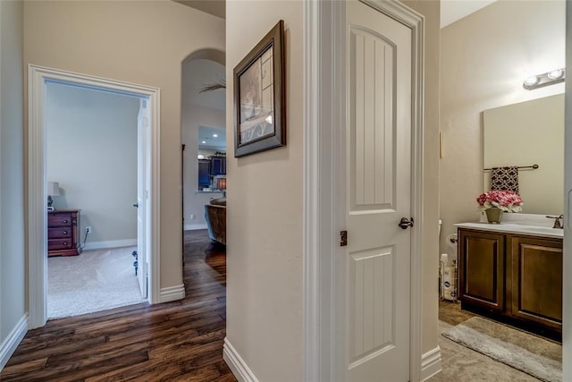 2717 Cordgrass Ln, Edmond, OK 73013 - corridor featuring dark wood finished floors and baseboards