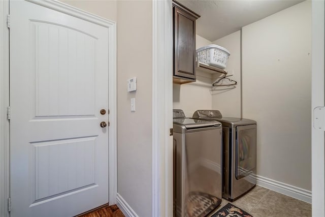 2717 Cordgrass Ln, Edmond, OK 73013 - washroom with cabinet space, washing machine and dryer, and baseboards