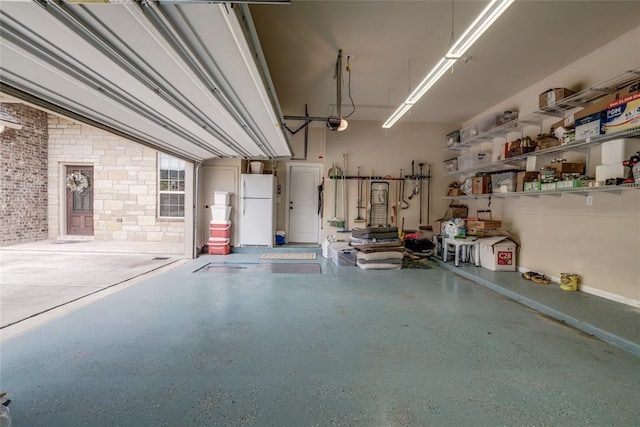 2717 Cordgrass Ln, Edmond, OK 73013 - garage with freestanding refrigerator