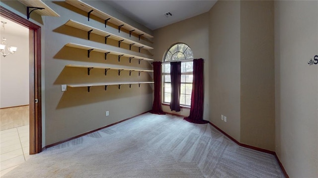 832 Elm Creek Dr, Moore, OK 73160 - carpeted empty room featuring a chandelier and baseboards