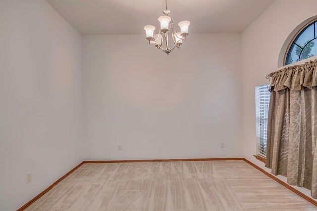 832 Elm Creek Dr, Moore, OK 73160 - carpeted empty room featuring a chandelier, plenty of natural light, and baseboards