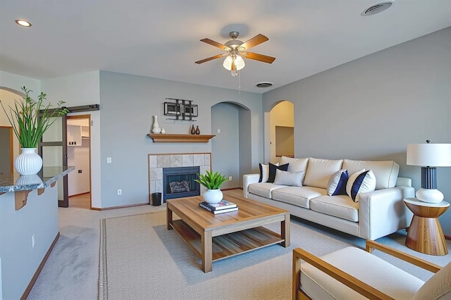 832 Elm Creek Dr, Moore, OK 73160 - living area featuring arched walkways, a ceiling fan, light carpet, recessed lighting, and baseboards