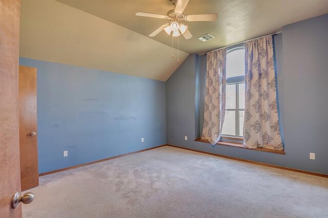 832 Elm Creek Dr, Moore, OK 73160 - additional living space with carpet floors, vaulted ceiling, a ceiling fan, and baseboards
