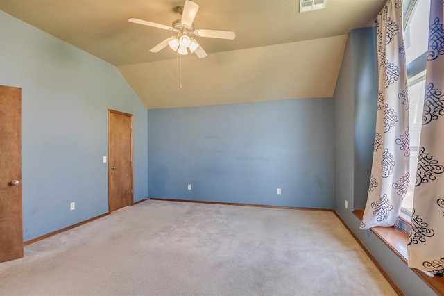 832 Elm Creek Dr, Moore, OK 73160 - empty room featuring carpet, vaulted ceiling, ceiling fan, and baseboards