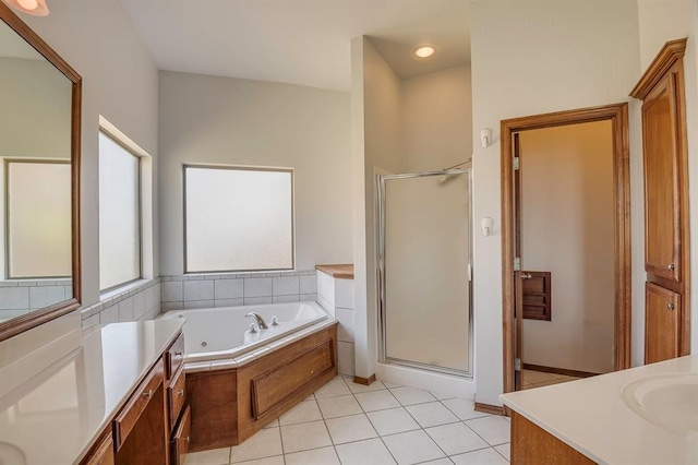 832 Elm Creek Dr, Moore, OK 73160 - full bathroom featuring a stall shower, a jetted tub, vanity, and tile patterned flooring
