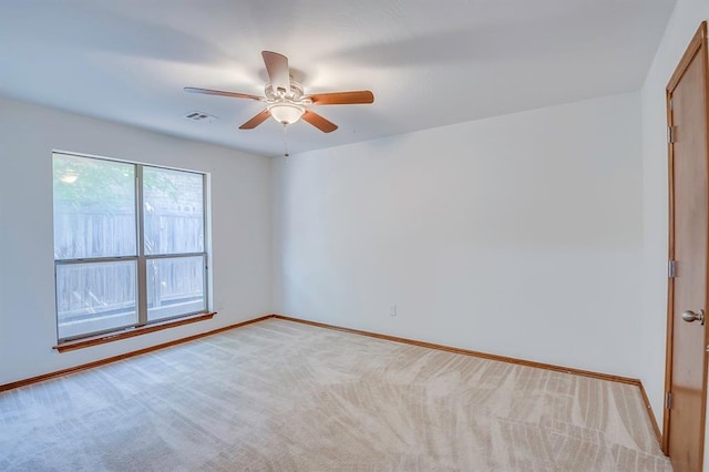 832 Elm Creek Dr, Moore, OK 73160 - empty room featuring baseboards, ceiling fan, and light carpet