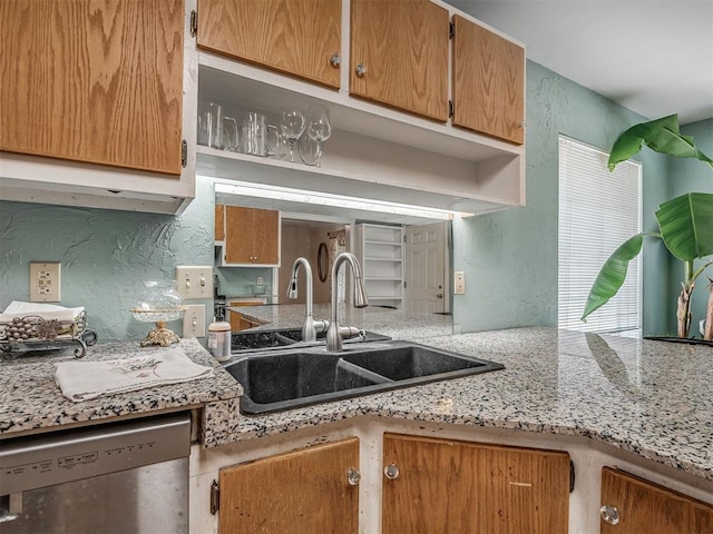 2604 Jeannes Trl, Edmond, OK 73012 - kitchen featuring dishwasher, a sink, and a textured wall