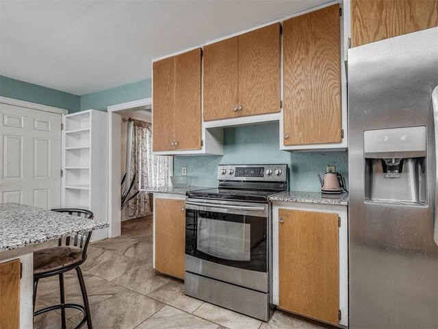 2604 Jeannes Trl, Edmond, OK 73012 - kitchen featuring stainless steel appliances and light stone counters