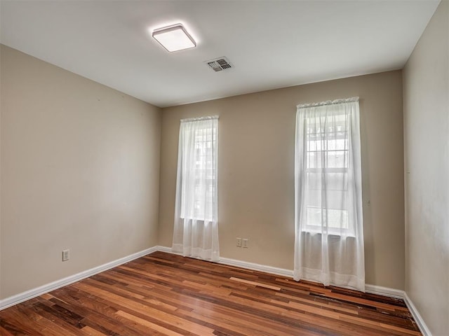 2604 Jeannes Trl, Edmond, OK 73012 - unfurnished room with wood finished floors and baseboards