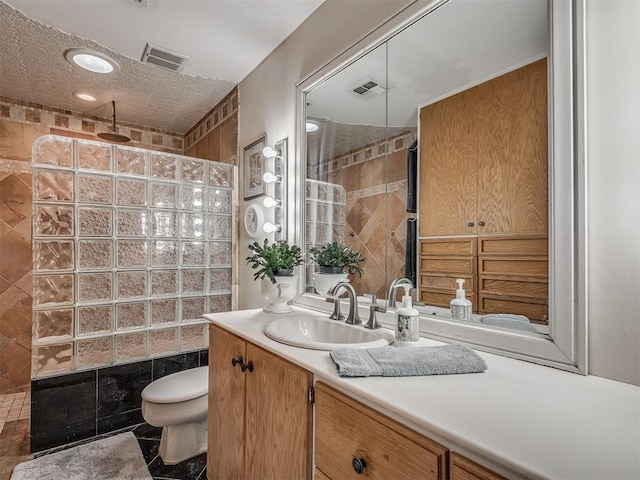 2604 Jeannes Trl, Edmond, OK 73012 - bathroom with vanity, a walk in shower, and toilet