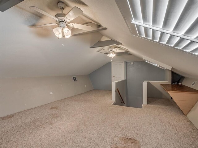2604 Jeannes Trl, Edmond, OK 73012 - bonus room with ceiling fan, carpet, and lofted ceiling