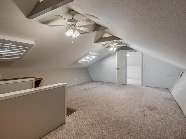 2604 Jeannes Trl, Edmond, OK 73012 - bonus room with ceiling fan, lofted ceiling, and carpet