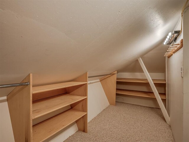 2604 Jeannes Trl, Edmond, OK 73012 - walk in closet with carpet floors