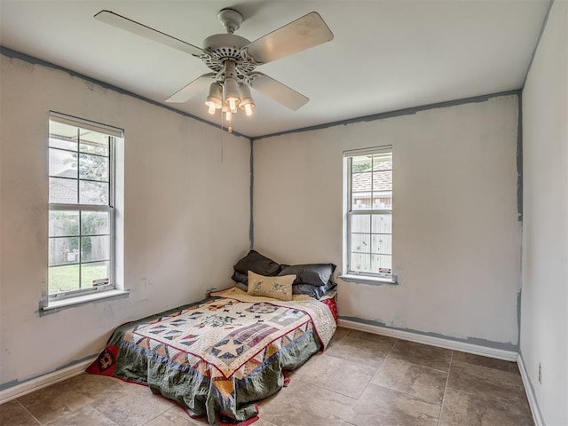 2604 Jeannes Trl, Edmond, OK 73012 - bedroom with baseboards and ceiling fan