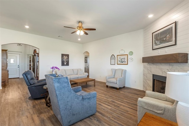 29731 Jade St, Cashion, OK 73016 - living area featuring arched walkways, wood finished floors, ceiling fan, a fireplace, and recessed lighting
