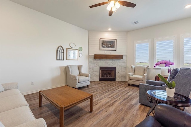 29731 Jade St, Cashion, OK 73016 - living room with wood finished floors, ceiling fan, a fireplace, and recessed lighting