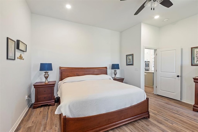29731 Jade St, Cashion, OK 73016 - bedroom with light wood finished floors, a ceiling fan, and recessed lighting