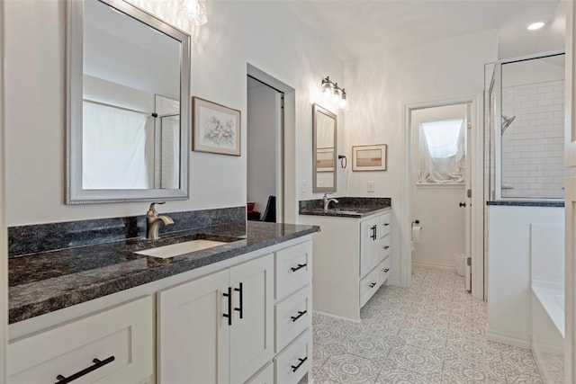 29731 Jade St, Cashion, OK 73016 - bathroom featuring tiled shower, two vanities, a tub to relax in, and tile patterned flooring