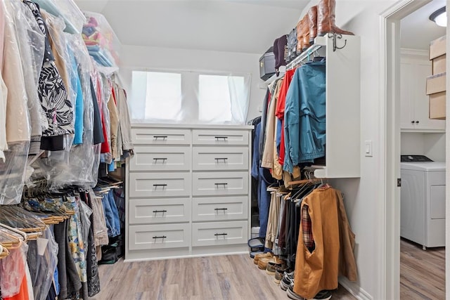 29731 Jade St, Cashion, OK 73016 - spacious closet featuring washer / clothes dryer and light wood-style floors