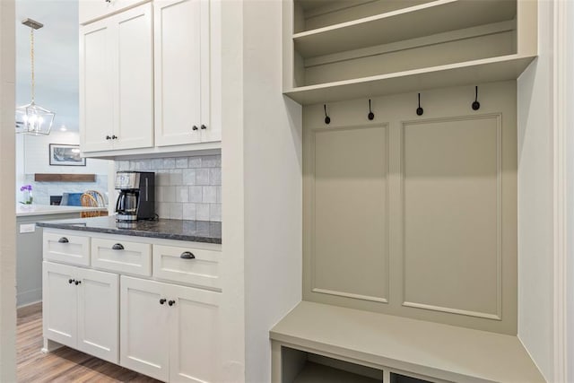 29731 Jade St, Cashion, OK 73016 - mudroom with light wood finished floors and a chandelier