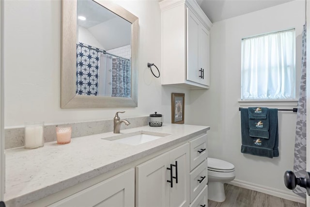 29731 Jade St, Cashion, OK 73016 - full bath featuring vanity, wood finished floors, and vaulted ceiling