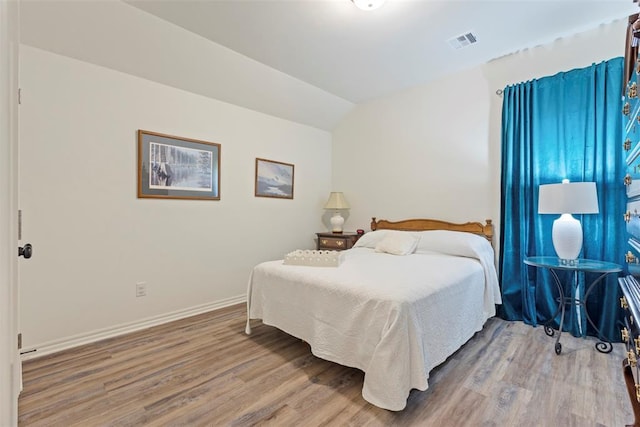 29731 Jade St, Cashion, OK 73016 - bedroom with wood finished floors and lofted ceiling
