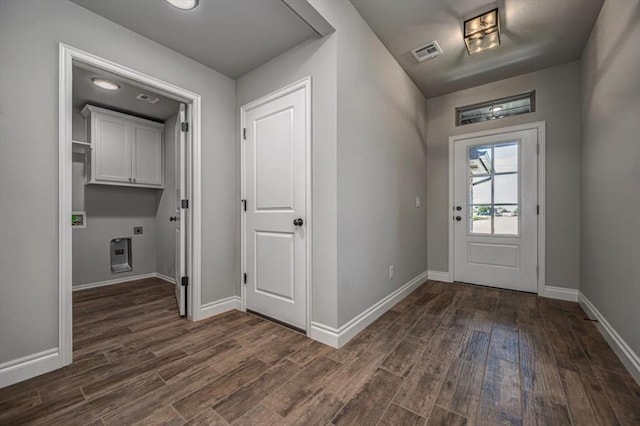 2000 W Flintlock Way, Mustang, OK 73065 - entryway with dark wood-style flooring and baseboards
