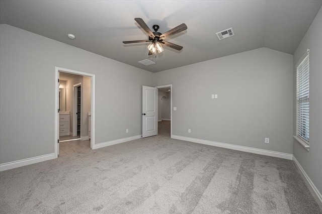 2000 W Flintlock Way, Mustang, OK 73065 - unfurnished bedroom with carpet floors, lofted ceiling, baseboards, and ceiling fan