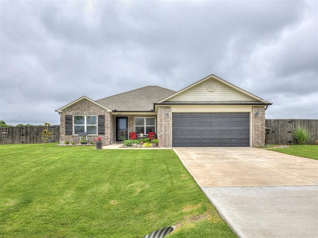 42173 N Max Henry Dr, Shawnee, OK 74804 - view of front facade featuring an attached garage, concrete driveway, and brick siding