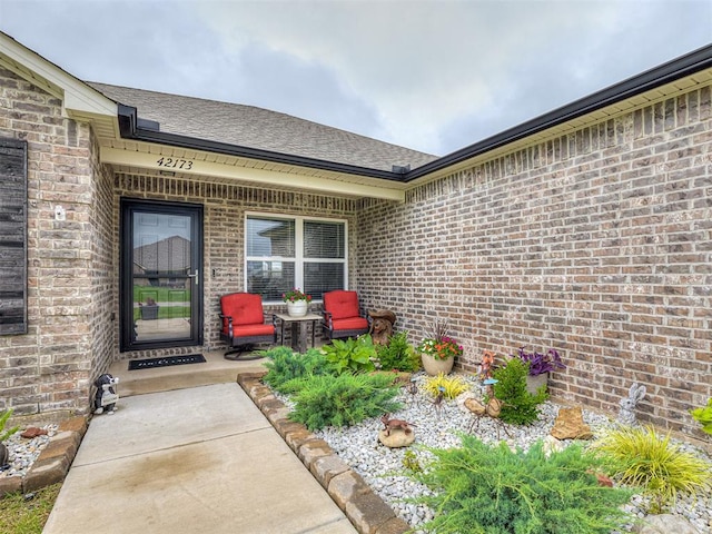 42173 N Max Henry Dr, Shawnee, OK 74804 - property entrance with brick siding and roof with shingles