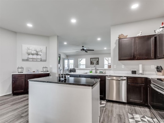 42173 N Max Henry Dr, Shawnee, OK 74804 - kitchen featuring stainless steel appliances, a sink, light wood-type flooring, recessed lighting, and dark brown cabinets
