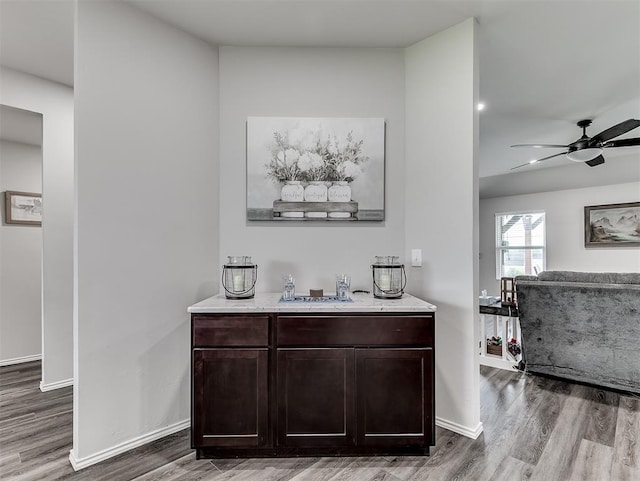 42173 N Max Henry Dr, Shawnee, OK 74804 - bar featuring wood finished floors, a sink, a ceiling fan, and baseboards