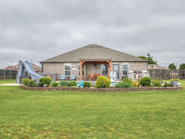42173 N Max Henry Dr, Shawnee, OK 74804 - back of property with brick siding, a patio, a gazebo, and a shingled roof