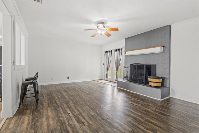 2020 Lyle Rd, Weatherford, OK 73096 - unfurnished living room with ceiling fan, a large fireplace, wood finished floors, and baseboards