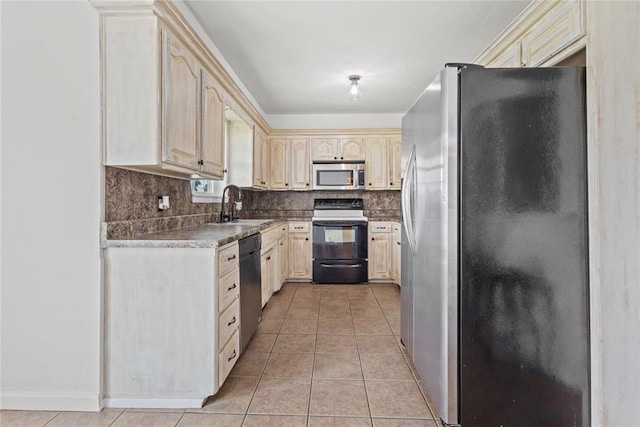 2020 Lyle Rd, Weatherford, OK 73096 - kitchen featuring stainless steel appliances, a sink, light tile patterned floors, tasteful backsplash, and cream cabinets