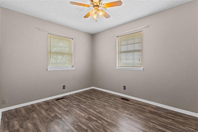 2020 Lyle Rd, Weatherford, OK 73096 - empty room featuring wood finished floors, a ceiling fan, a textured ceiling, and baseboards